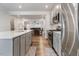 Gourmet kitchen with stainless steel appliances, gray cabinets, and an island at 1430 Rosepine Dr, Cary, NC 27519