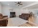 Comfortable living room with plush seating, ceiling fan, and a view into the kitchen at 1430 Rosepine Dr, Cary, NC 27519