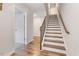 Staircase with wood treads and iron spindles provides access to upper levels, and has abundant natural light at 1430 Rosepine Dr, Cary, NC 27519