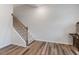 Staircase with hardwood flooring and neutral walls at 1430 Rosepine Dr, Cary, NC 27519