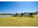 Expansive, well-maintained backyard with a lush lawn and white fence, perfect for outdoor activities at 156 Bornean Dr, Garner, NC 27529