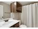 Bathroom featuring vanity with white sink, dark wood cabinets, and shower with curtain at 156 Bornean Dr, Garner, NC 27529