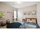 Cozy bedroom featuring a blue rug, natural light, and whimsical decor at 156 Bornean Dr, Garner, NC 27529