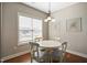 Cozy dining area with natural light and a chandelier at 156 Bornean Dr, Garner, NC 27529