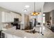 Bright kitchen featuring granite countertops and stainless steel appliances at 156 Bornean Dr, Garner, NC 27529