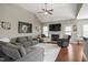 Cozy living room featuring a fireplace, high ceiling, and ample seating at 156 Bornean Dr, Garner, NC 27529