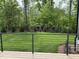 View of the back yard and wooded area from the wood deck with metal railing at 162 Lookout Rdg # 677, Pittsboro, NC 27312