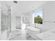 Modern bathroom with soaking tub, tiled floors, and glass shower at 162 Lookout Rdg # 677, Pittsboro, NC 27312