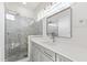 Modern bathroom featuring a glass enclosed shower, white countertops, and gray cabinetry at 162 Lookout Rdg # 677, Pittsboro, NC 27312