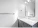 Bathroom with a light gray vanity, sleek mirror, and modern fixtures, offering a clean and functional space at 162 Lookout Rdg # 677, Pittsboro, NC 27312