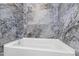 Stylish bathtub with unique tile surround, ready for a relaxing soak at 162 Lookout Rdg # 677, Pittsboro, NC 27312