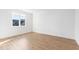Bright bedroom with wood floors, white walls, a window, and natural light streaming in from the outside at 162 Lookout Rdg # 677, Pittsboro, NC 27312