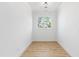 Bright bedroom with hardwood floors, white walls, large window, and modern ceiling light at 162 Lookout Rdg # 677, Pittsboro, NC 27312