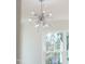 Close-up of modern chandelier with silver finish and crystal accents at 162 Lookout Rdg # 677, Pittsboro, NC 27312