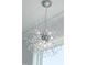 A modern starburst chandelier with clear beads hangs from the ceiling at 162 Lookout Rdg # 677, Pittsboro, NC 27312