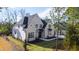 Beautifully landscaped two-story home with a combination of brick and white siding at 162 Lookout Rdg # 677, Pittsboro, NC 27312