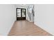 Entryway with wood floors, black double doors, and stairs, creating an open and inviting entrance at 162 Lookout Rdg # 677, Pittsboro, NC 27312