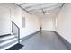 A spacious two car garage with epoxy floors and white painted walls at 162 Lookout Rdg # 677, Pittsboro, NC 27312