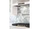Close up of gas range with decorative backsplash and range hood at 162 Lookout Rdg # 677, Pittsboro, NC 27312