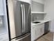 Modern kitchen with stainless steel appliances, white cabinets, and subway tile backsplash at 162 Lookout Rdg # 677, Pittsboro, NC 27312