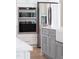 Modern kitchen featuring stainless steel appliances and a gray kitchen island at 162 Lookout Rdg # 677, Pittsboro, NC 27312