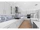 Spacious kitchen with white cabinets, quartz countertops, and stainless steel appliances at 162 Lookout Rdg # 677, Pittsboro, NC 27312