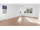Bright living room featuring hardwood floors, modern lighting, and large windows at 162 Lookout Rdg # 677, Pittsboro, NC 27312