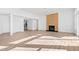 Bright living room featuring a fireplace, wood floors, and views of the staircase at 162 Lookout Rdg # 677, Pittsboro, NC 27312
