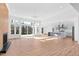 Spacious living room featuring lots of natural light, wood floors, and a view of the kitchen at 162 Lookout Rdg # 677, Pittsboro, NC 27312