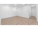 A bright, airy living room boasts white walls and wood floors with recessed lights and many windows at 162 Lookout Rdg # 677, Pittsboro, NC 27312