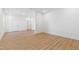 This is a living room with hardwood floors, several doors, and empty walls at 162 Lookout Rdg # 677, Pittsboro, NC 27312