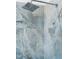 Close up of the shower head and shower tiles made of marble and blue veining at 162 Lookout Rdg # 677, Pittsboro, NC 27312