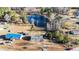 An aerial view of a property featuring a quaint house and a serene pond, surrounded by mature trees at 186 Sunrise Dr, Sanford, NC 27332