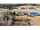 Aerial view of the property and neighborhood featuring a large lot and mature trees at 186 Sunrise Dr, Sanford, NC 27332