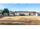 Spacious backyard featuring a wooden deck, play area, and ample space for outdoor activities at 186 Sunrise Dr, Sanford, NC 27332