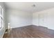 Bedroom featuring wood floors, a ceiling light, and a closet at 186 Sunrise Dr, Sanford, NC 27332