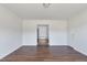 Bedroom with wood floors, a bathroom entrance, and a door at 186 Sunrise Dr, Sanford, NC 27332