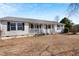 Charming single-story house with a welcoming front porch and well-maintained yard at 186 Sunrise Dr, Sanford, NC 27332
