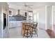 Kitchen island with seating area and white cabinetry at 186 Sunrise Dr, Sanford, NC 27332