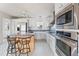 Eat-in kitchen with stainless appliances, modern fixtures, and an island at 186 Sunrise Dr, Sanford, NC 27332
