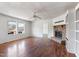 Inviting living room filled with natural light, featuring hardwood floors and a traditional fireplace at 186 Sunrise Dr, Sanford, NC 27332