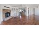 Open-concept living room featuring a fireplace, hardwood floors, and ample natural light at 186 Sunrise Dr, Sanford, NC 27332