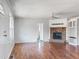 Bright living room with beautiful flooring, a cozy fireplace, and a welcoming atmosphere at 186 Sunrise Dr, Sanford, NC 27332