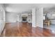Spacious living room featuring a brick fireplace, wood floors, and ceiling fans at 186 Sunrise Dr, Sanford, NC 27332