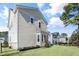 Side view of a two-story house with a well-kept lawn and a glimpse of neighboring houses at 200 Gravel Brook Ct, Cary, NC 27519