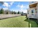 Spacious backyard featuring a lush lawn, privacy fence, and a partially shaded patio area at 200 Gravel Brook Ct, Cary, NC 27519