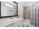 Stylish bathroom with a shower-tub combo, and a large framed mirror at 200 Gravel Brook Ct, Cary, NC 27519