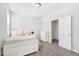Bedroom featuring neutral decor, soft lighting, and adjoining closet at 200 Gravel Brook Ct, Cary, NC 27519