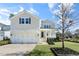 Inviting two-story home with a covered front porch, landscaped yard, and a convenient two-car garage at 200 Gravel Brook Ct, Cary, NC 27519
