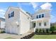 Charming two-story home with a landscaped yard, inviting front porch, and a spacious two-car garage at 200 Gravel Brook Ct, Cary, NC 27519